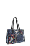 Bosque de Amor denim tote bag featuring floral and bird embroidery with black handles.