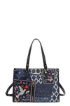 Bosque de Amor denim tote bag with colorful embroidered designs and stylish handles.
