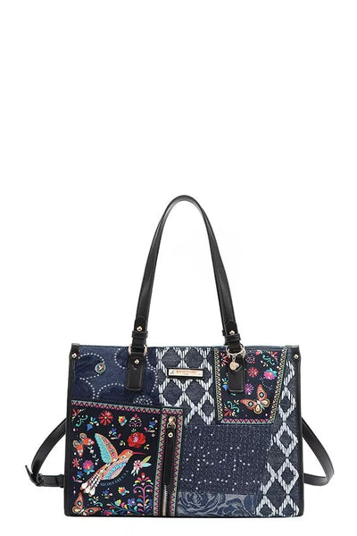 Bosque de Amor denim tote bag with colorful embroidered designs and stylish handles.